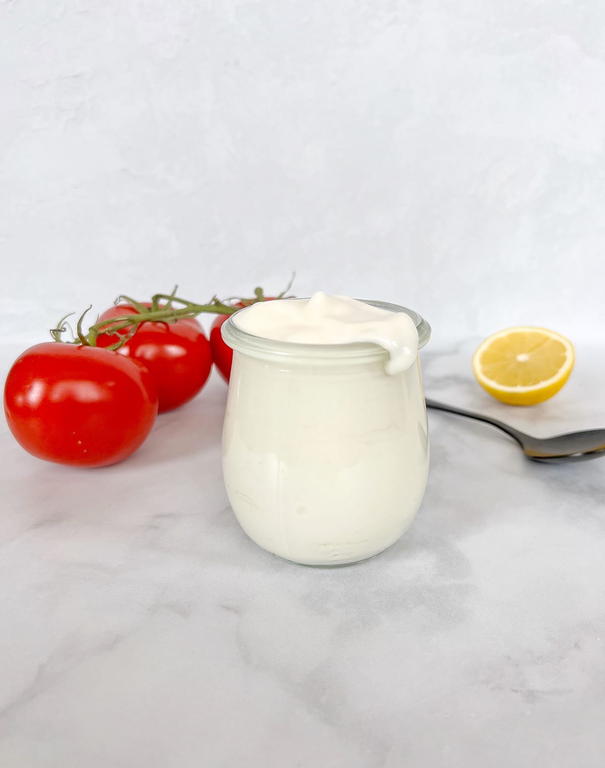 Vegan mayonnaise in a glass.